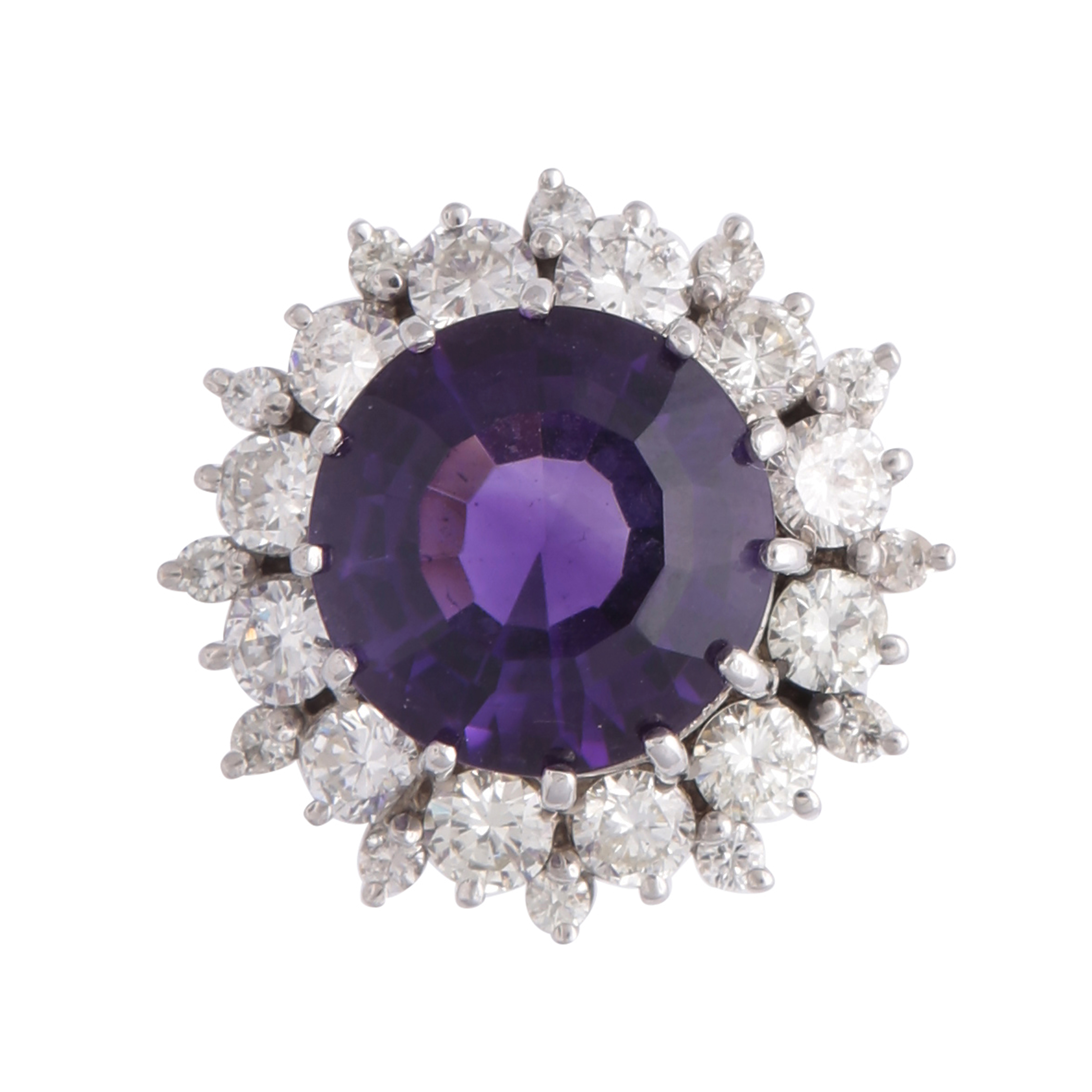 A magnificent amethyst and diamond cluster dress ring in white gold or platinum, the large,