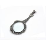 A Sterling Silver mounted magnifying glass pendant designed as a mermaid, her body on one side of