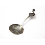 An antique Dutch silver jam / condiment spoon pseudo marked and with English import marks for