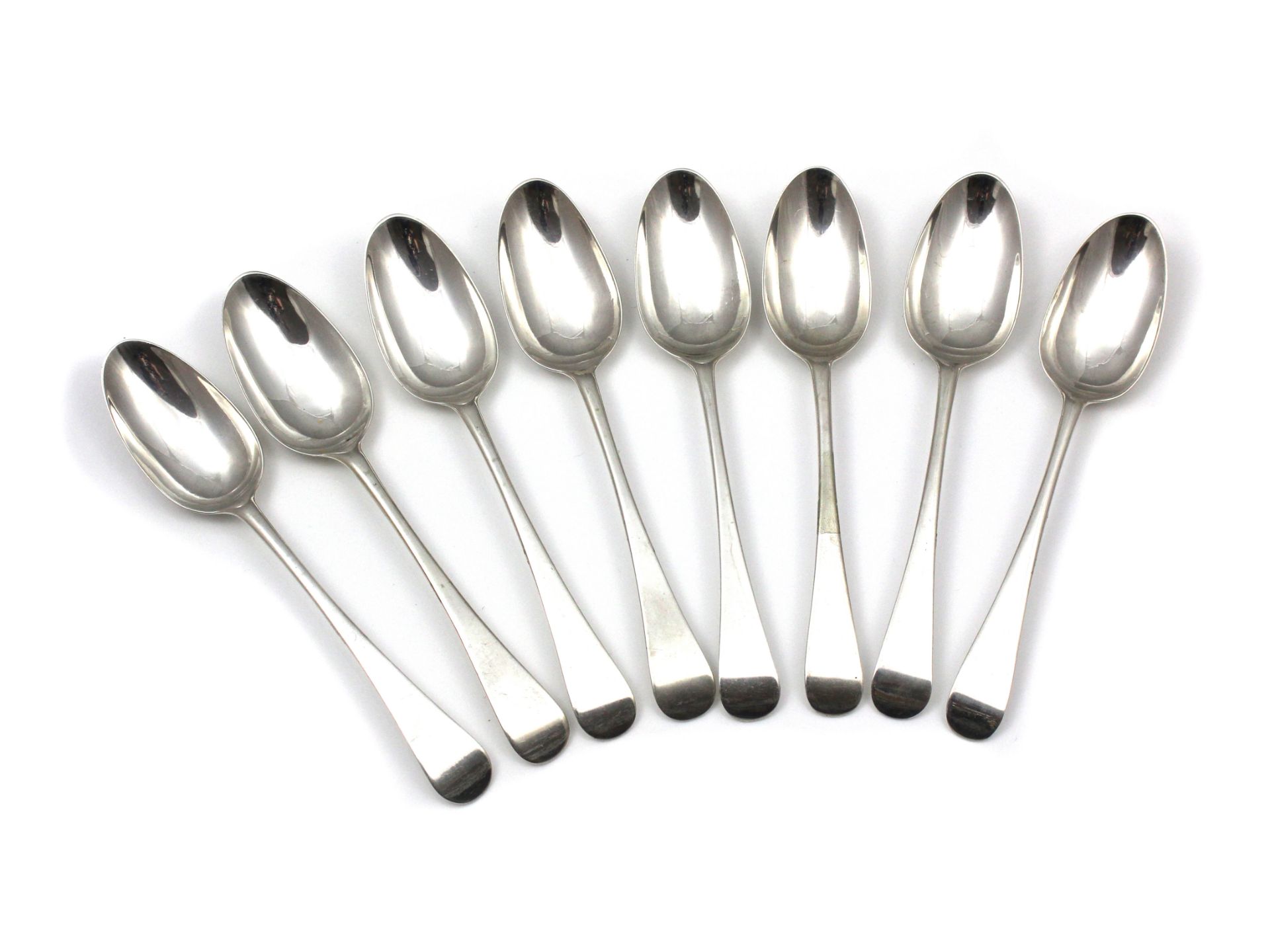 A set of eight antique George III Sterling Silver dessert spoons maker's mark S J, London 1767. In