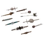 A collection of antique and vintage brooches and tie pins to include five silver brooches and one