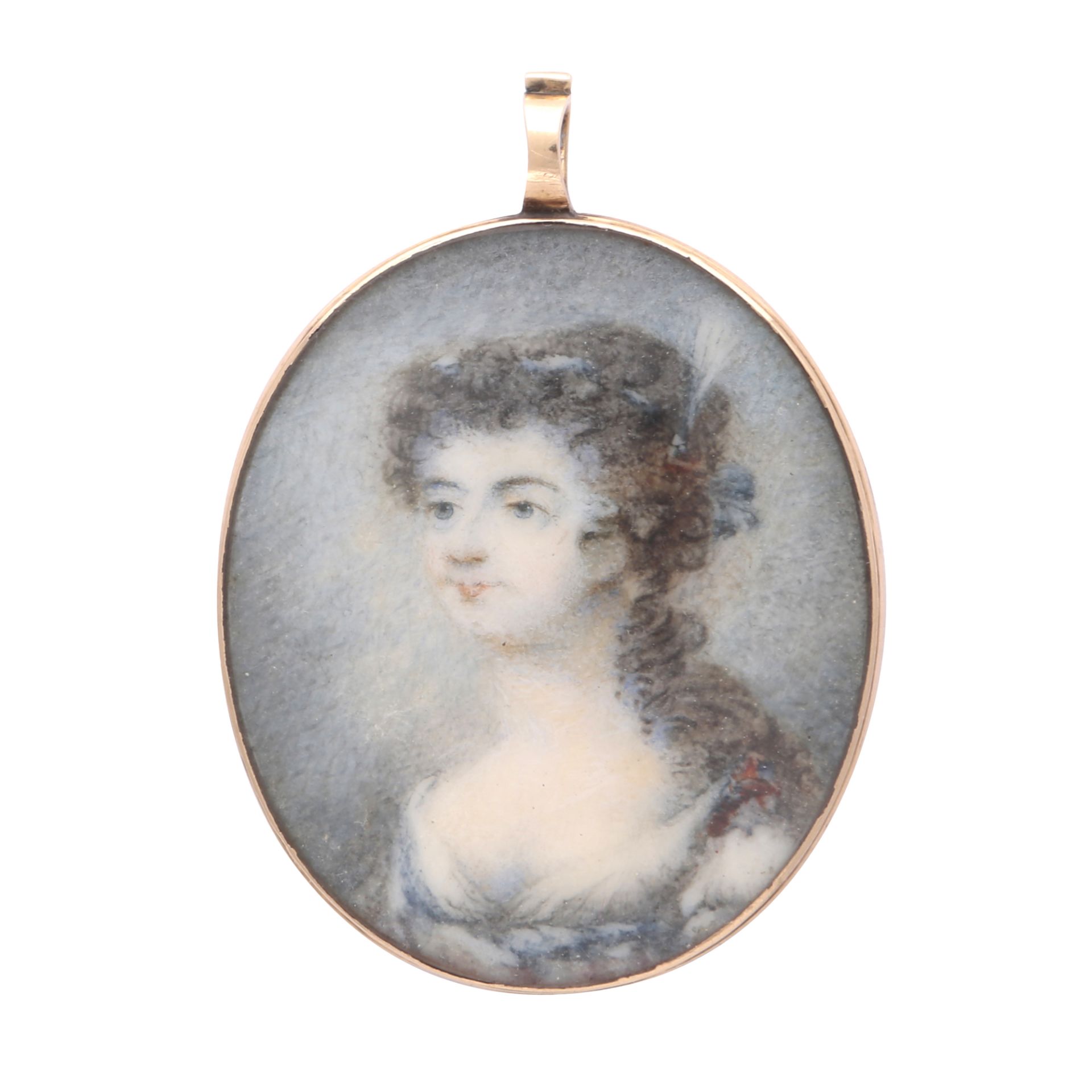 An antique Georgian portrait miniature pendant circa 1780, of oval form depicting a young lady in