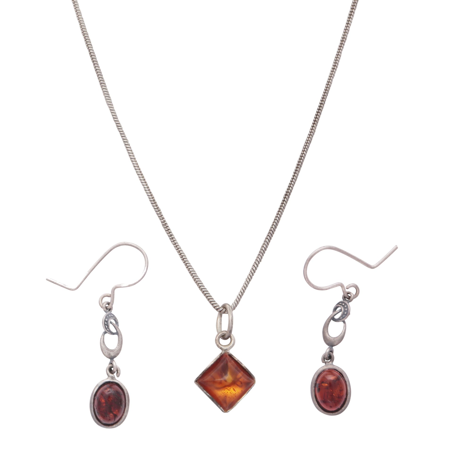 An amber demi parure in sterling silver comprising a pendant and chain together with a pair of