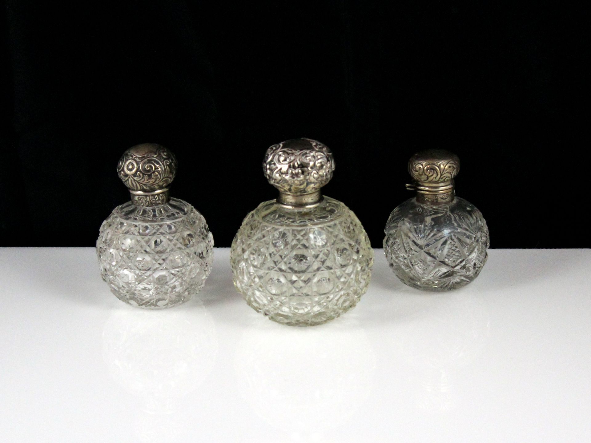 Three antique Victorian / Edwardian Sterling Silver scent bottles, Birmingham 1901, 1906 and Chester