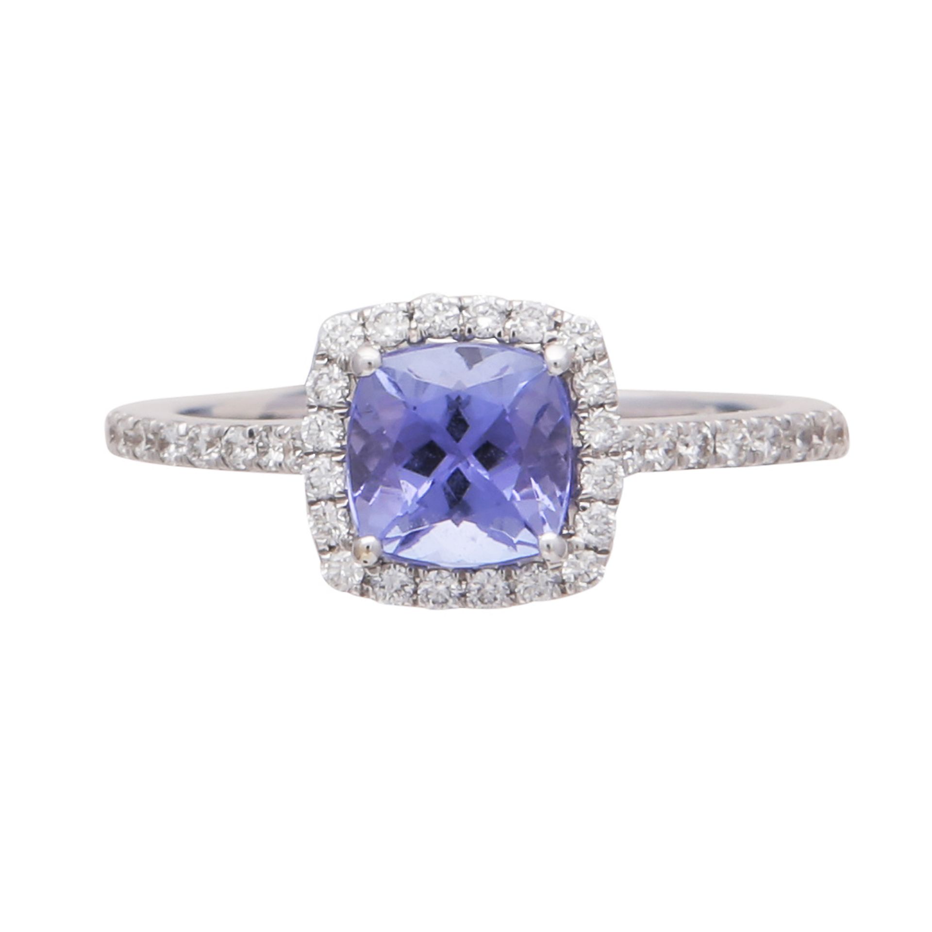 A tanzanite and diamond cluster ring in 18ct white gold the central cushion cut tanzanite weighing