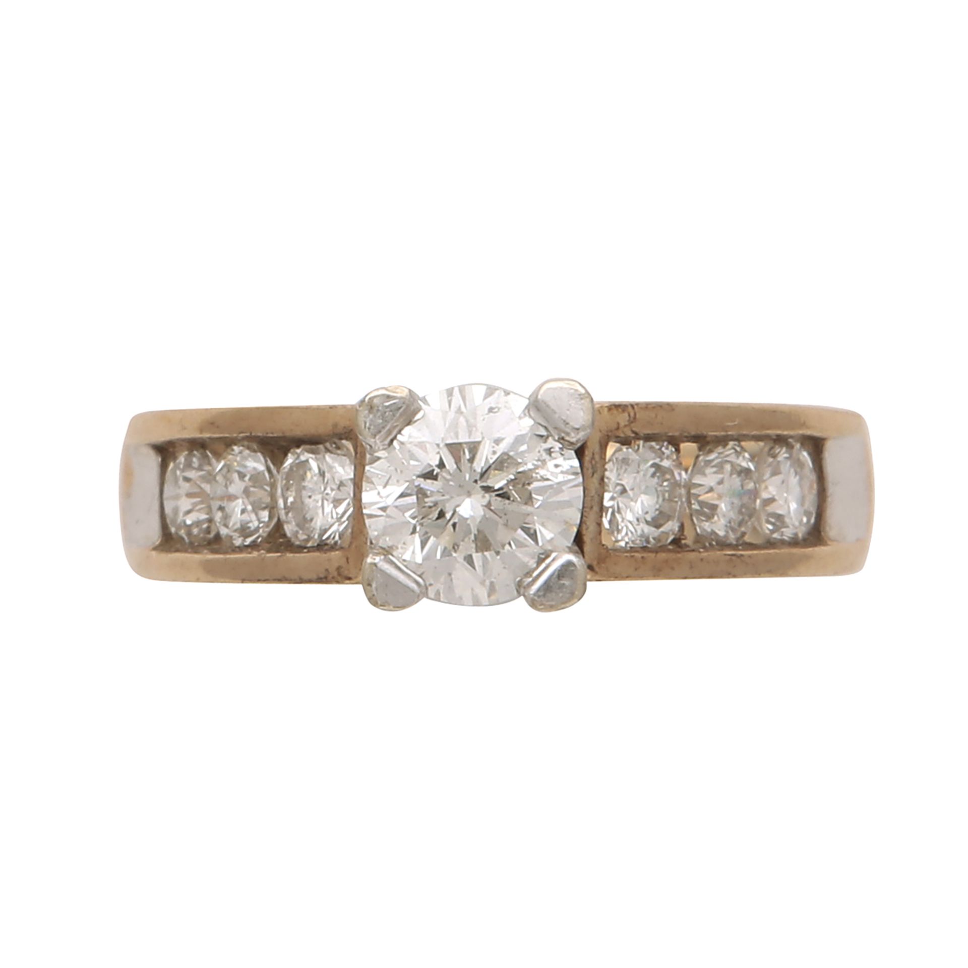 A diamond dress ring in yellow gold set with a round cut stone weighing approximately 0.76cts,