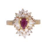 A ruby and diamond cluster ring in 14ct yellow gold the pear shaped ruby claw set, surrounded by a