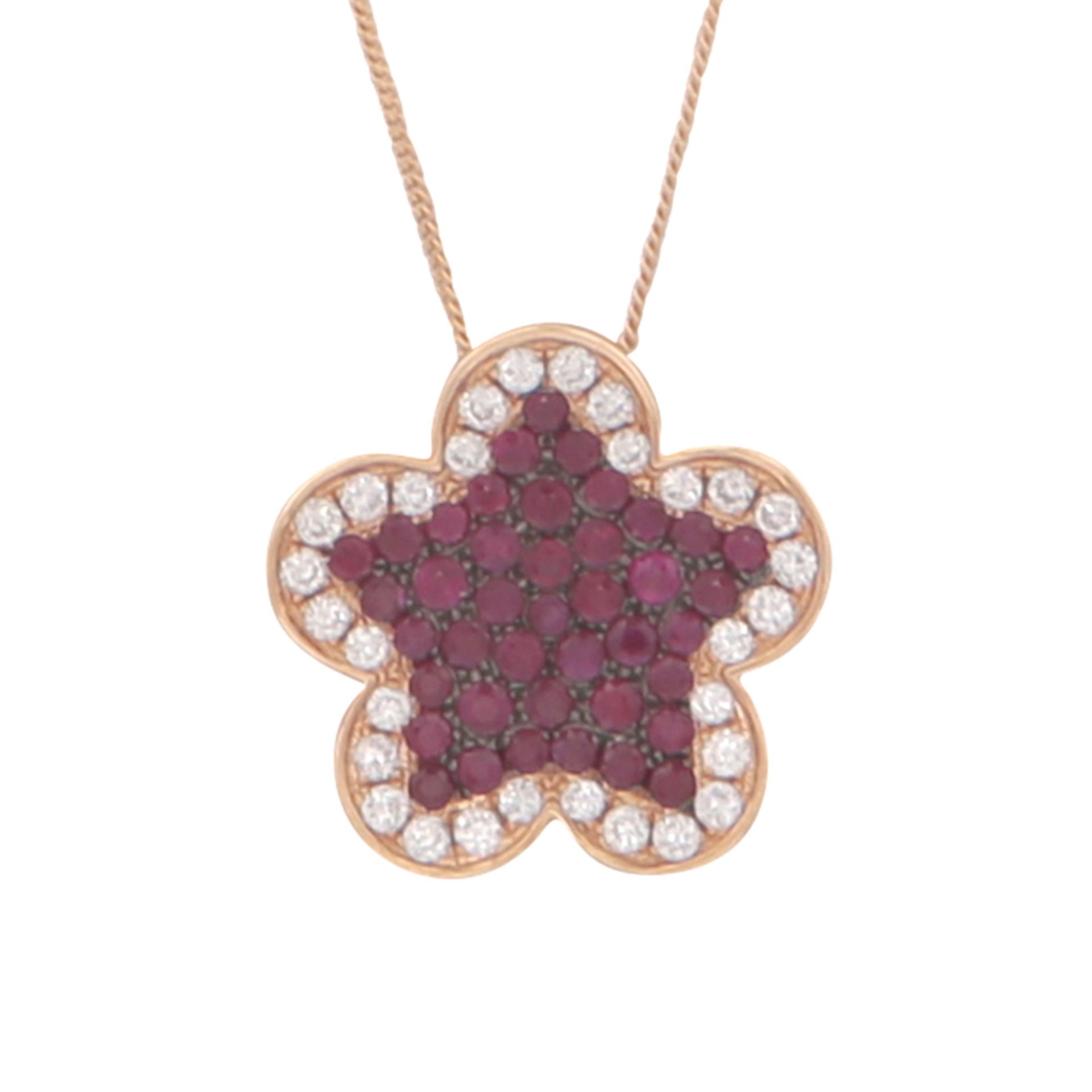 A ruby and diamond pendant and chain 18ct yellow gold designed as a five petal flower set with a
