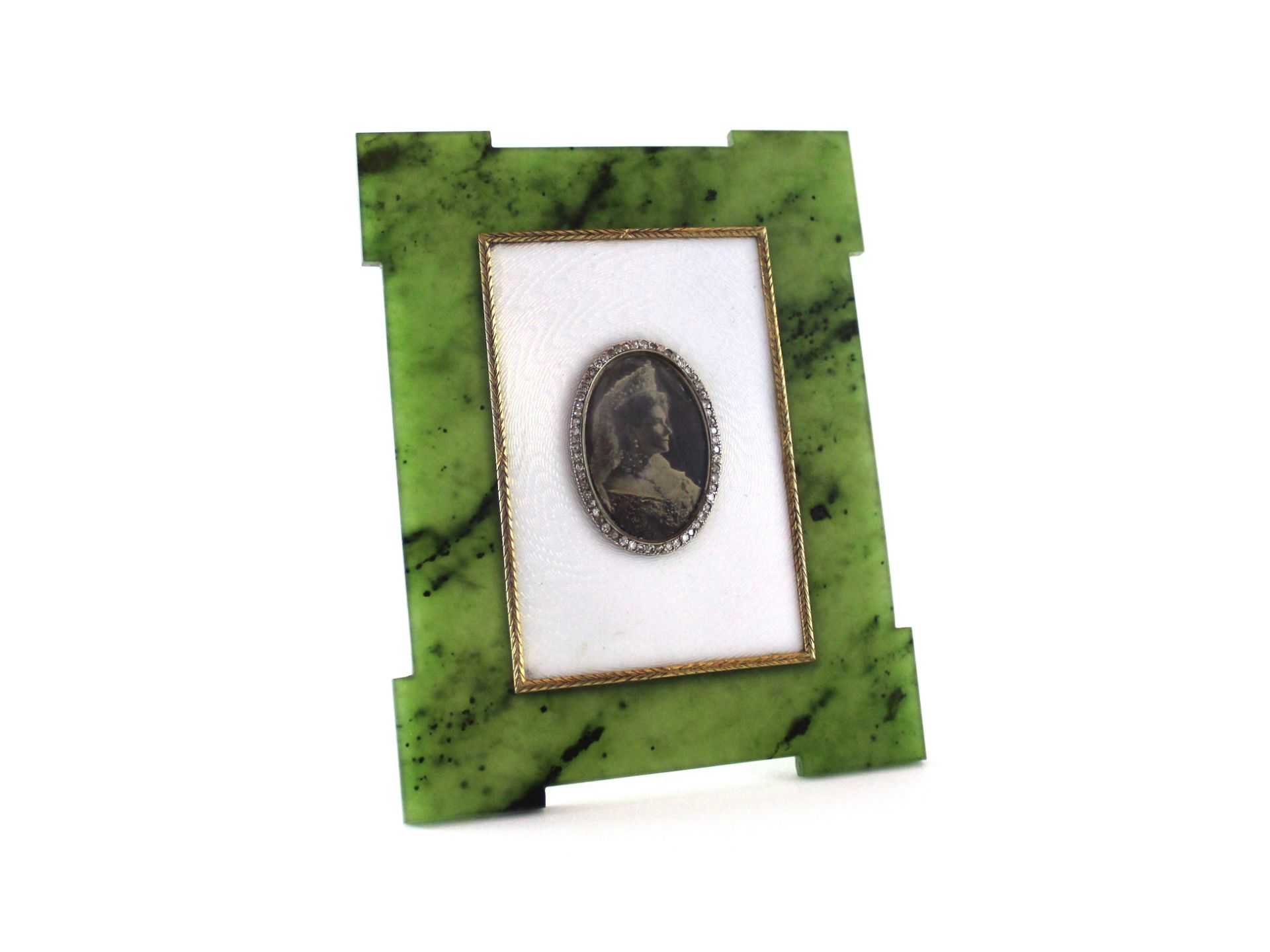 FABERGE An antique Imperial Russian jewelled gold, nephrite and enamel photograph frame by