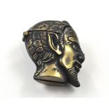 A novelty brass vesta case in the form of the devils head with gem set eyes. Height 4.5m / 1.75".