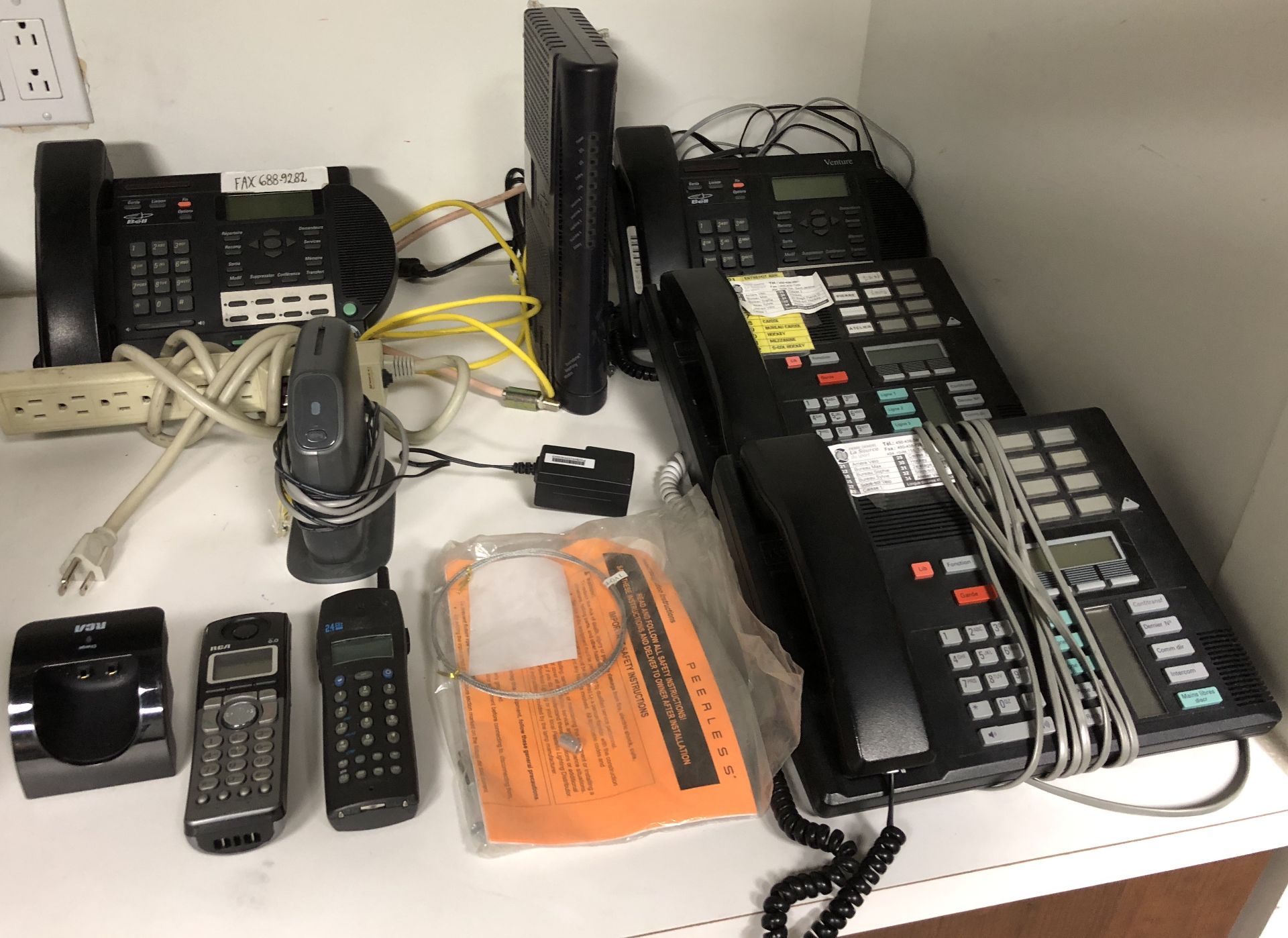 LOT OF OFFICE PHONES AND SMALL ROUTER, PLUS MISC ITEMS
