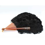 A spectacular antique French ostrich feather Burlesque style fan the sixteen blades formed of faux