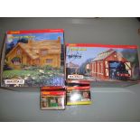A group of Hornby Skaledale to include Misdale House, an engine shed and two newspaper kiosks -