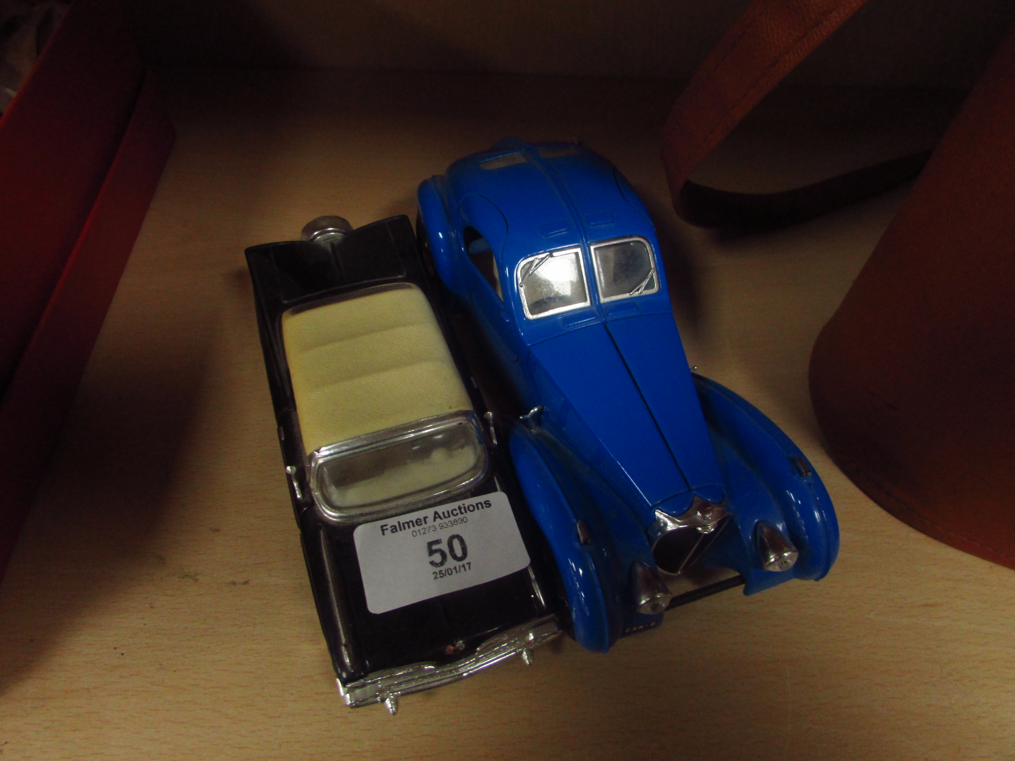 Buggati model car and Chevrolet Impala model car