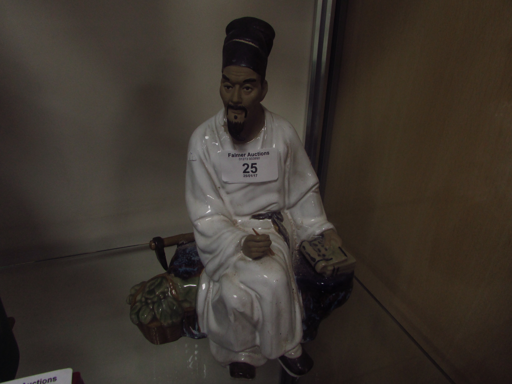 Oriental man figurine