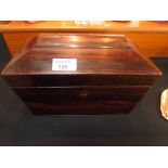 Twin section tea caddy sarcophygus form