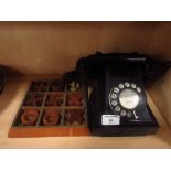 Wooden draught pieces and retro black telephone
