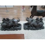 Pair of Chinese carved wood buffalos