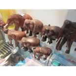 8 carved wood elephants