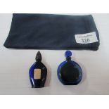 Blue Lalique perfume bottle and one other