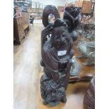 Large carved wood God fighting a beast. Approx 23" tall