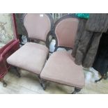 2 wood and pink fabric chairs