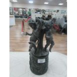 19thC bronze circular plinth moulded with putti supporting a spelter group of 3 putti