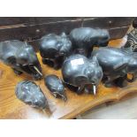 7 carved wood elephants