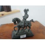 Bronze knight on horse back (sword blade missing)