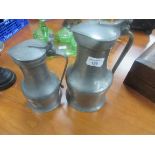 Graduated pair of Continental pewter lidded flagons