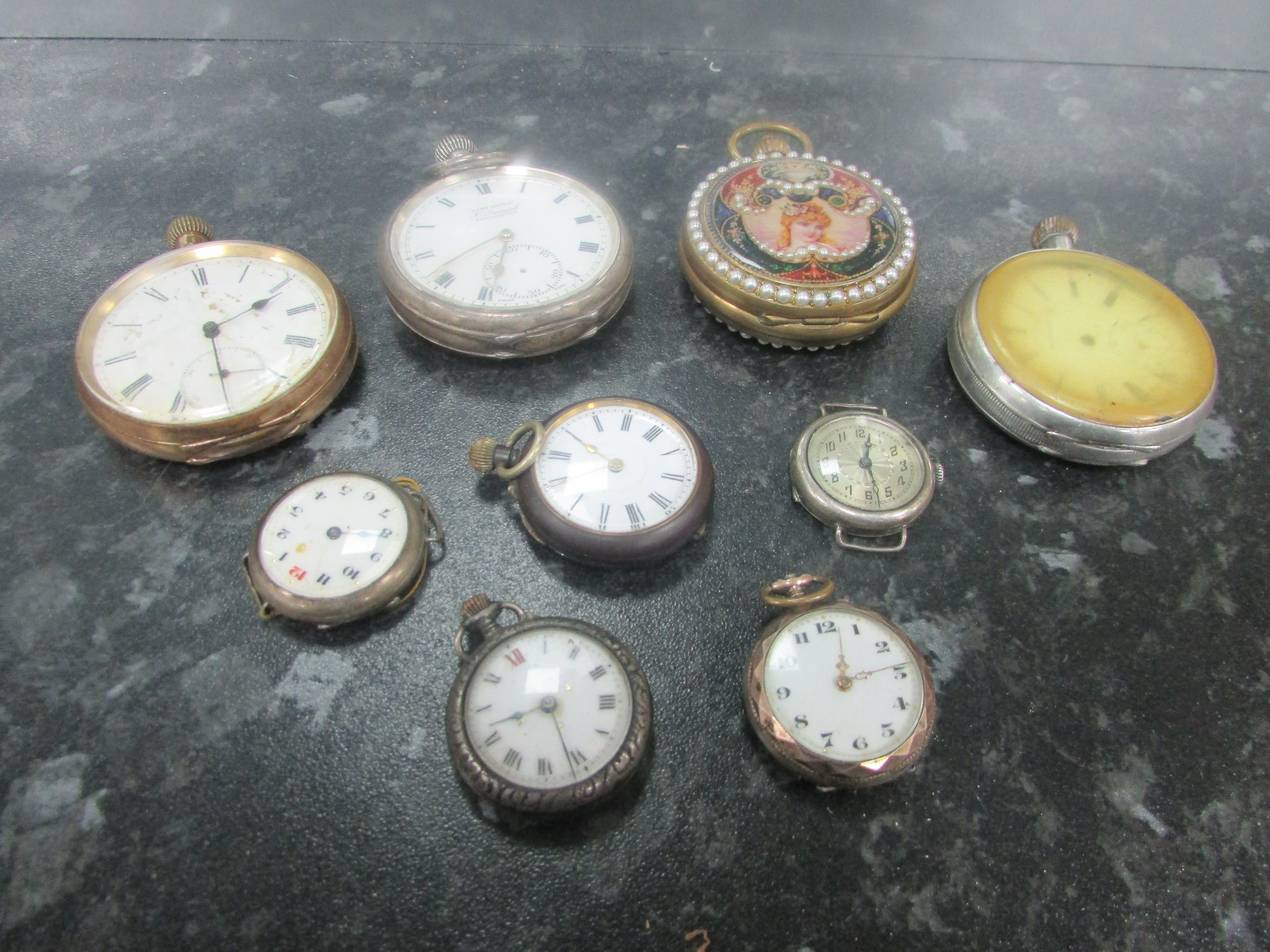 9 assorted pocket watches