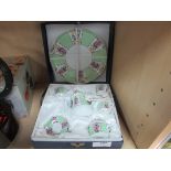 Boxed miniature china tea cups and plates