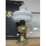 Brass oil lamp with opaque shade