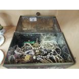 Tin box containing costume jewellery