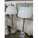 Pair of metal lamps with glass shades