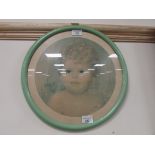 Round framed picture of a child