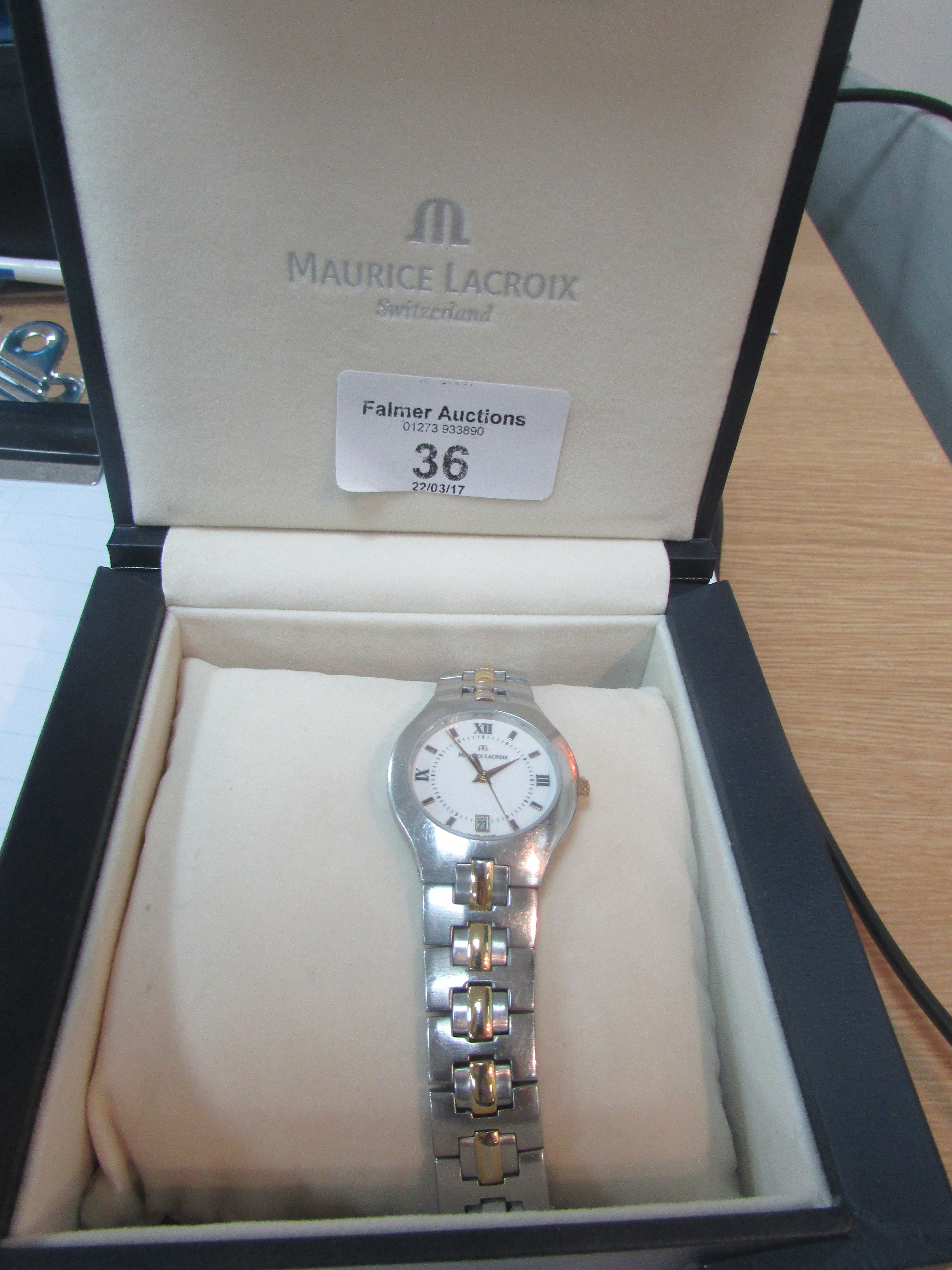 Maurie Lacroix ladies watch with box and all papers. Good working order.