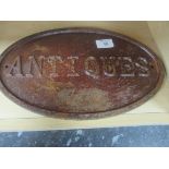 Oval cast iron reproduction antiques sign