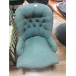 Green fabric and wood rocking chair