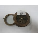 Unusual navigational compass and magnifying glass