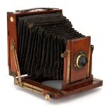 A Busch Camera Co. 'Tribees' Half Plate Mahogany Field Camera,