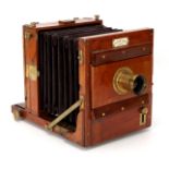 A Perken, Son & Rayment Portable Half Plate Mahogany Tailboard Camera,