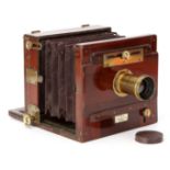 A Wratten & Wainwright Improved Folding Half Plate Mahogany Tailboard Camera,