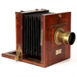 An Ebenezer H. Farrow Improved Pattern Half Plate Mahogany Tailboard Camera,