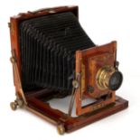 A Midland Camera Co. Half Plate Mahogany Field Camera,