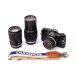 An Olympus OM-1 SLR Camera,