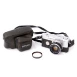 An Olympus Pen F Half Frame Camera,