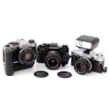 Three Olympus OM Series SLR Cameras,