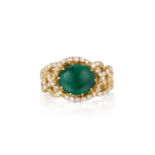 An Emerald and Diamond Ring