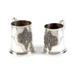 Two Italian silver coloured tapering mugs